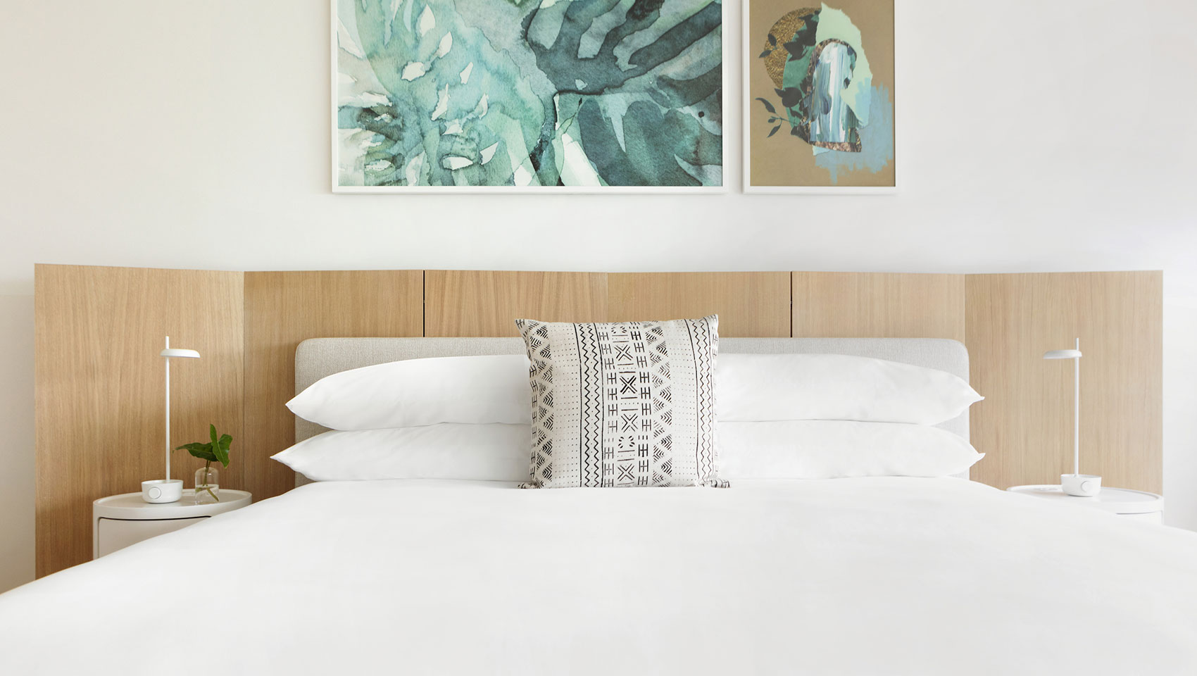 king bed with wooden headboard