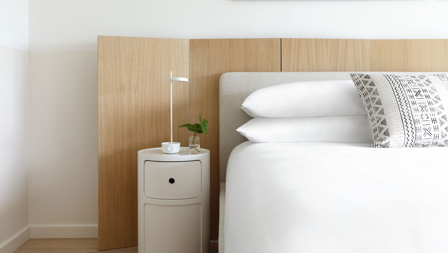 guestroom bed with bedside table