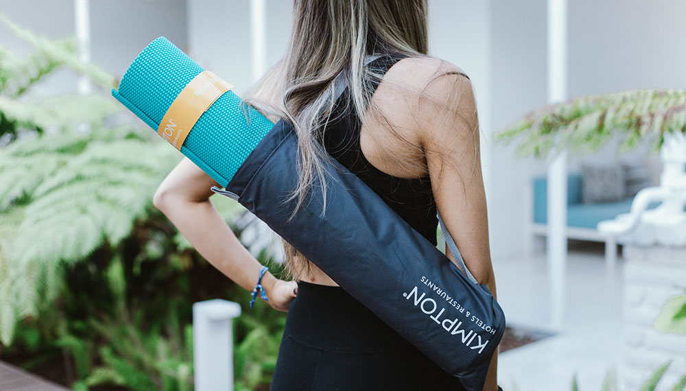 woman with Kimpton yoga map