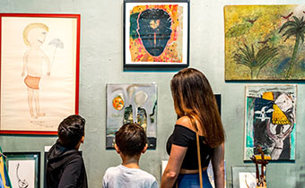family looking at paintings