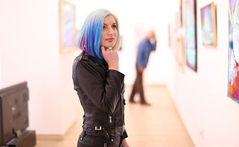 woman looking at art